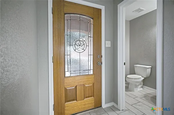 a bathroom with a toilet