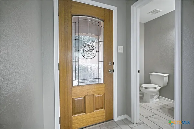 a bathroom with a toilet
