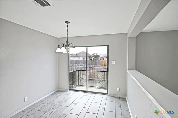 a view of a room with windows