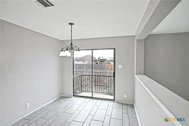 a view of a room with windows