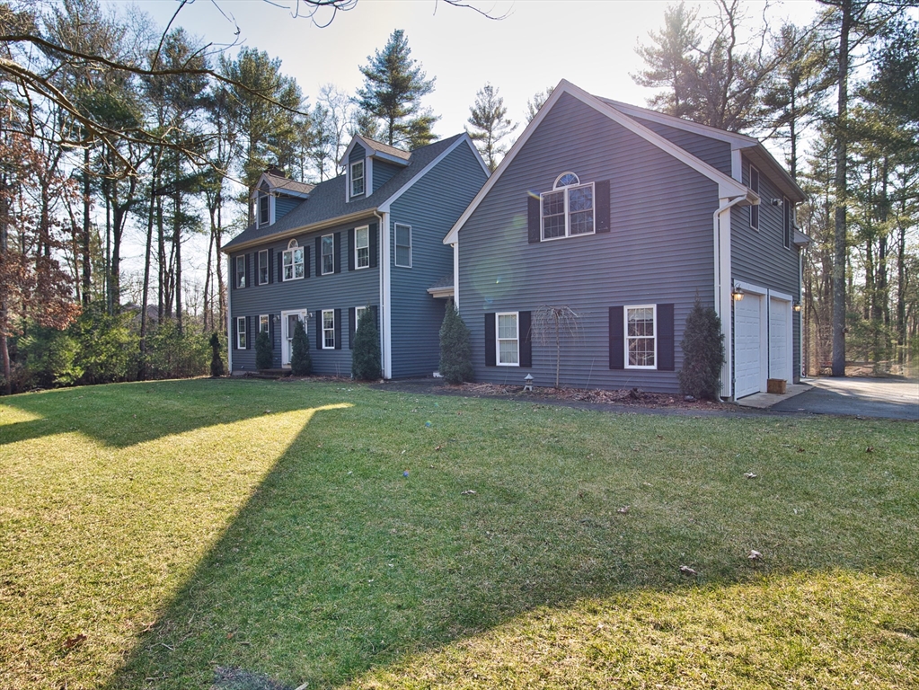109 Haskell Ridge Road Rochester, MA 02770 - Photo 3 of 33 a front view of house with yard and green space