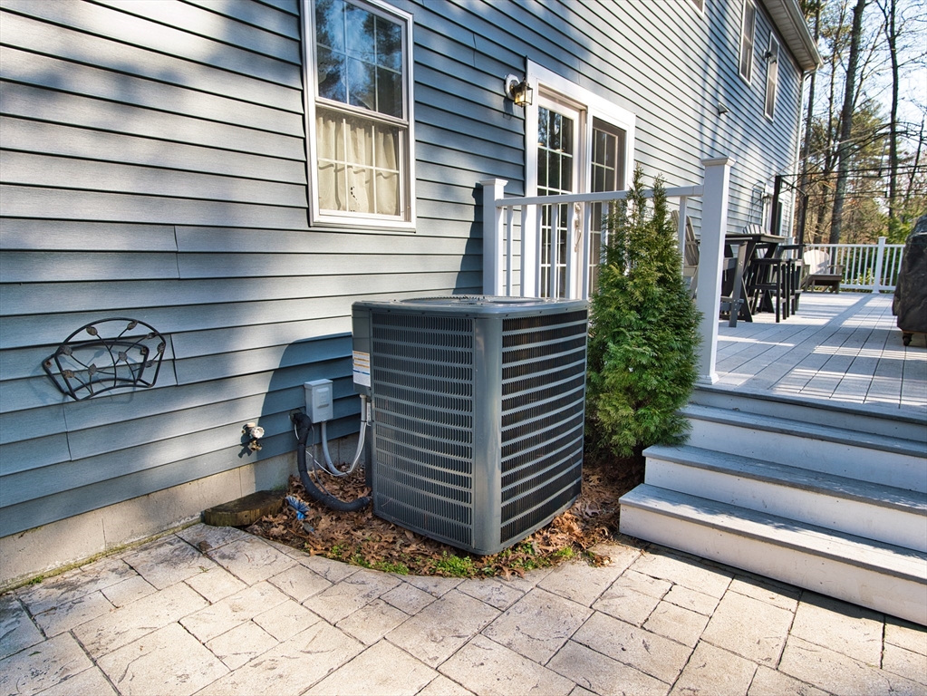 109 Haskell Ridge Road Rochester, MA 02770 - Photo 10 of 33 a side view of a house with entryway and a potted plant