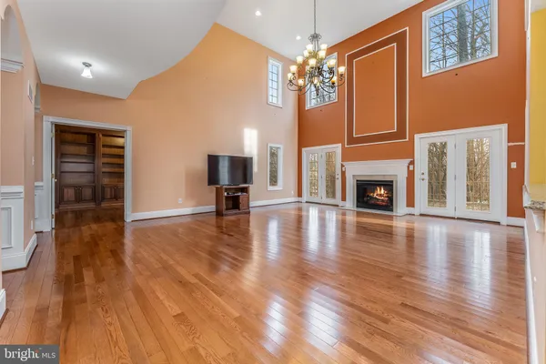 a view of livingroom with furniture wooden floor window and fireplace