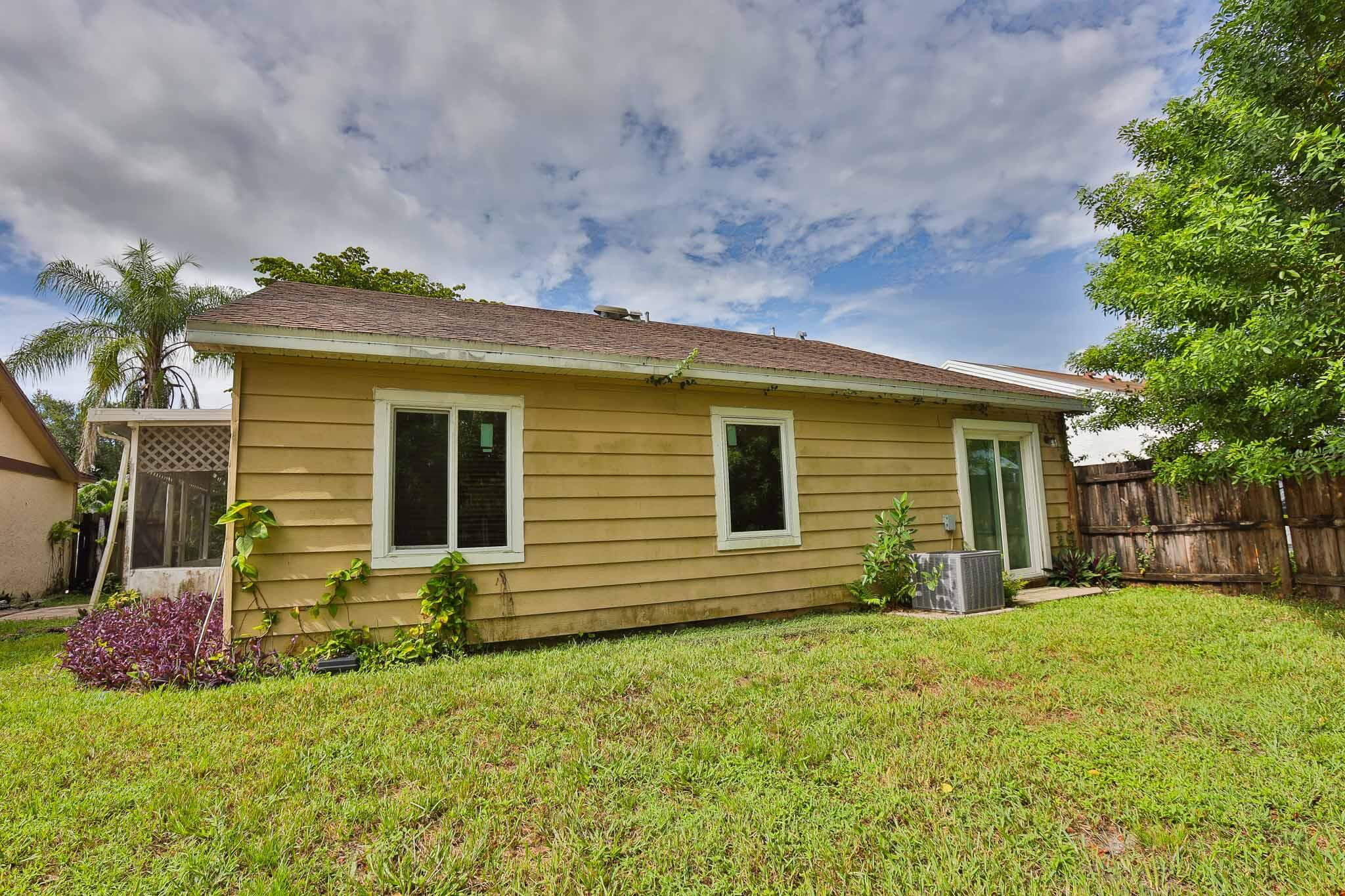 11223 Model Circle West Boca Raton, FL 33428 - Photo 25 of 35 a view of a house with a yard
