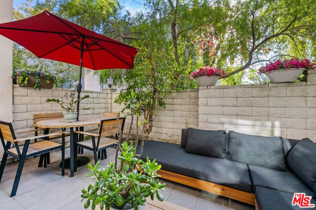 13231 Fiji Way, Unit F Marina del Rey, CA 90292 - Photo 11 of 40 a view of a tables and chairs under an umbrella in patio