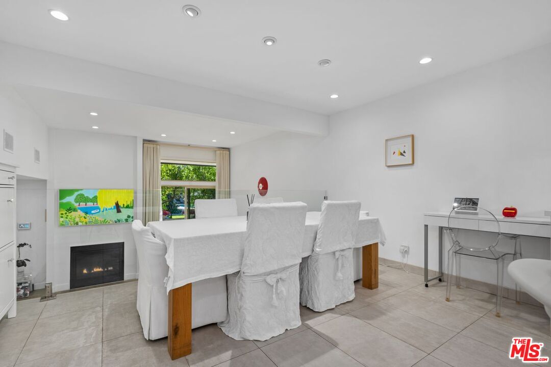 13231 Fiji Way, Unit F Marina del Rey, CA 90292 - Photo 14 of 40 a living room with furniture a computer on the desk and a rug