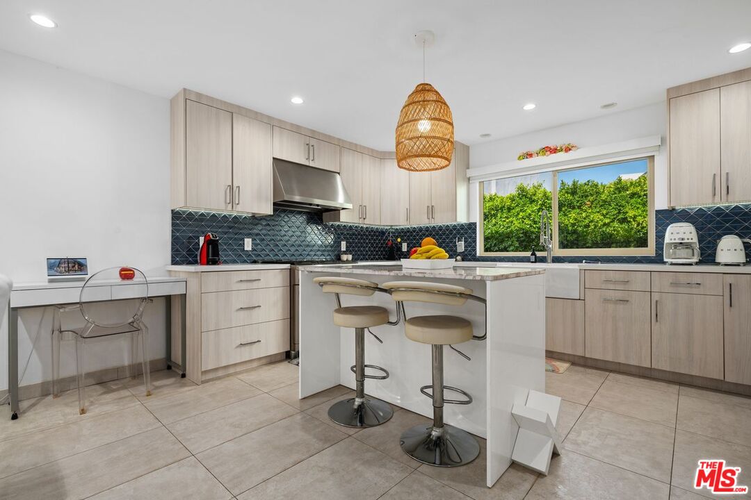 13231 Fiji Way, Unit F Marina del Rey, CA 90292 - Photo 16 of 40 a kitchen with sink cabinets and window
