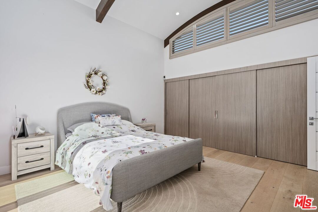 13231 Fiji Way, Unit F Marina del Rey, CA 90292 - Photo 22 of 40 a bedroom with a bed and a dresser