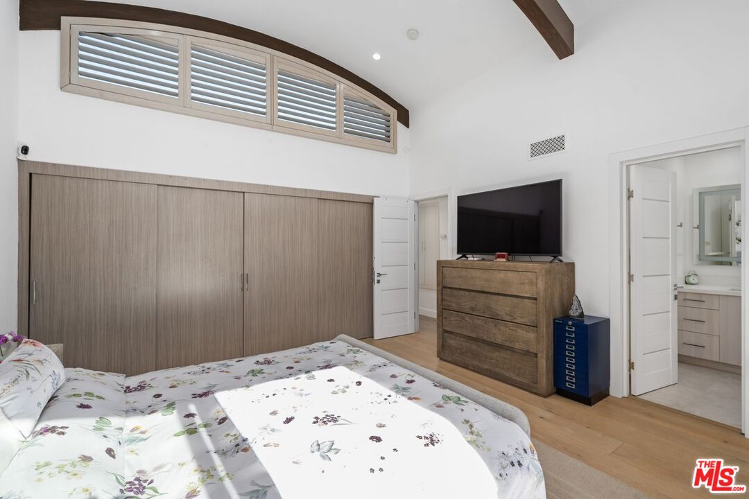 13231 Fiji Way, Unit F Marina del Rey, CA 90292 - Photo 23 of 40 a bed room with a bed and a television