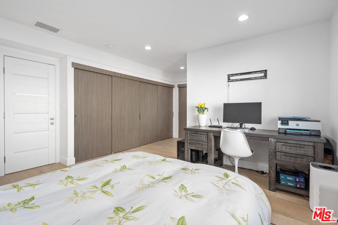 13231 Fiji Way, Unit F Marina del Rey, CA 90292 - Photo 30 of 40 a bedroom with a bed and a flat screen tv