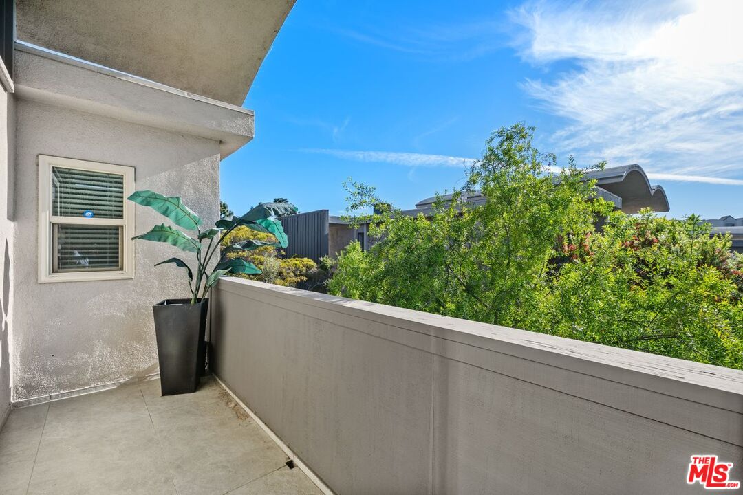 13231 Fiji Way, Unit F Marina del Rey, CA 90292 - Photo 33 of 40 a view of a balcony with chair and table