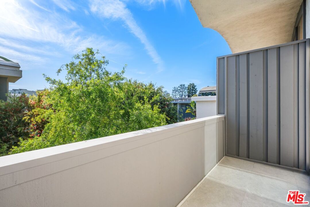 13231 Fiji Way, Unit F Marina del Rey, CA 90292 - Photo 34 of 40 a view of a balcony with potted plants