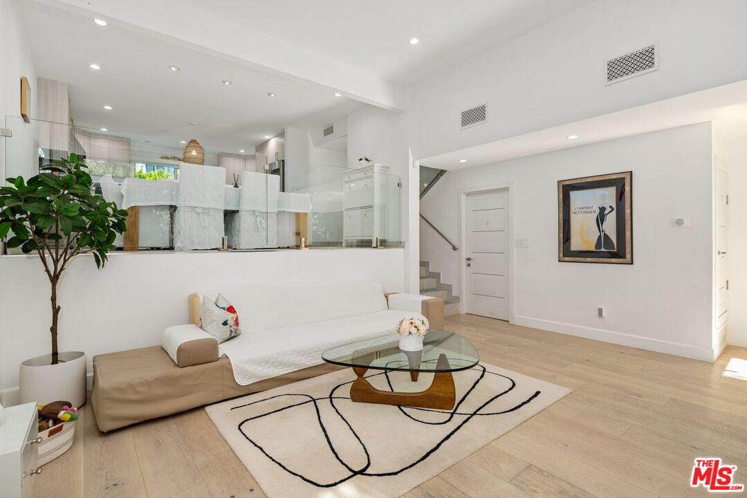 13231 Fiji Way, Unit F Marina del Rey, CA 90292 - Photo 6 of 40 a living room with furniture and flowers