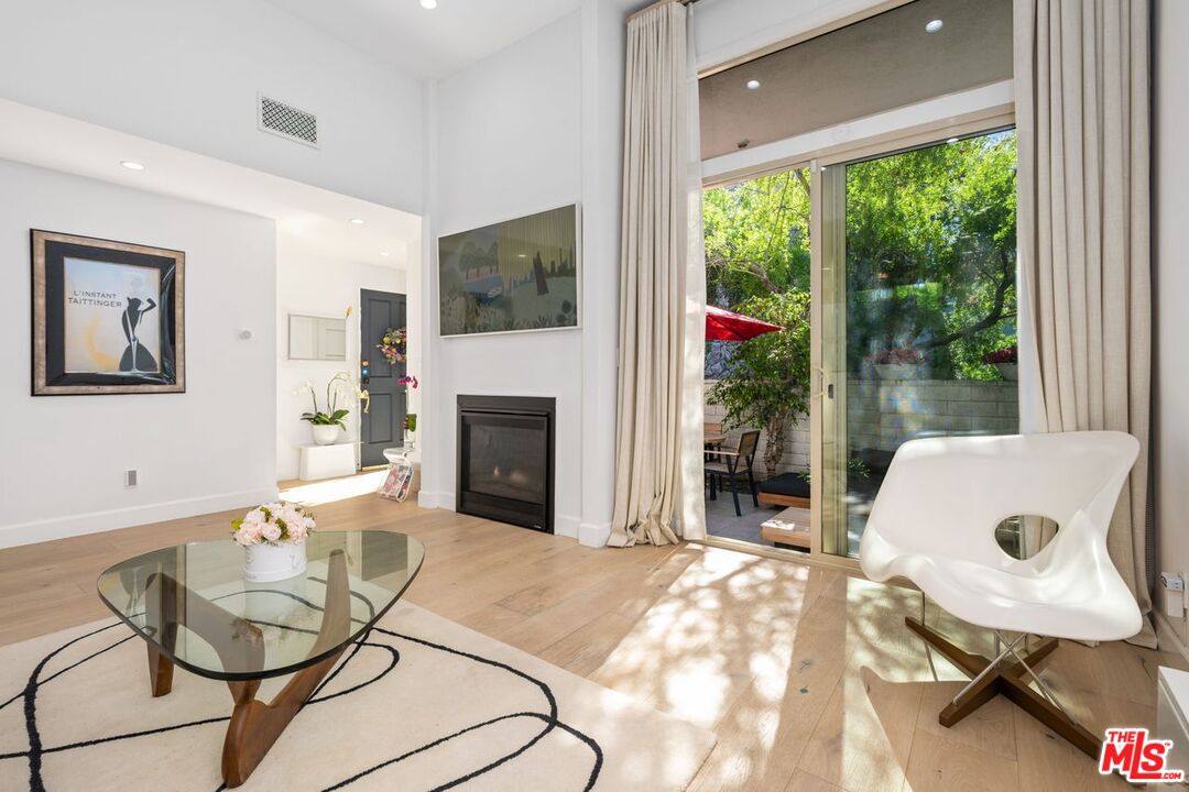 13231 Fiji Way, Unit F Marina del Rey, CA 90292 - Photo 7 of 40 a living room with furniture and a fireplace