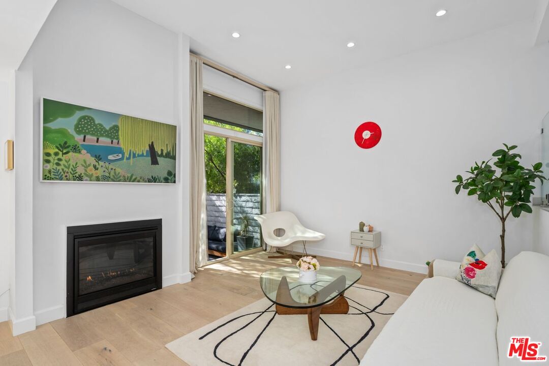 13231 Fiji Way, Unit F Marina del Rey, CA 90292 - Photo 9 of 40 a living room with furniture and a fireplace