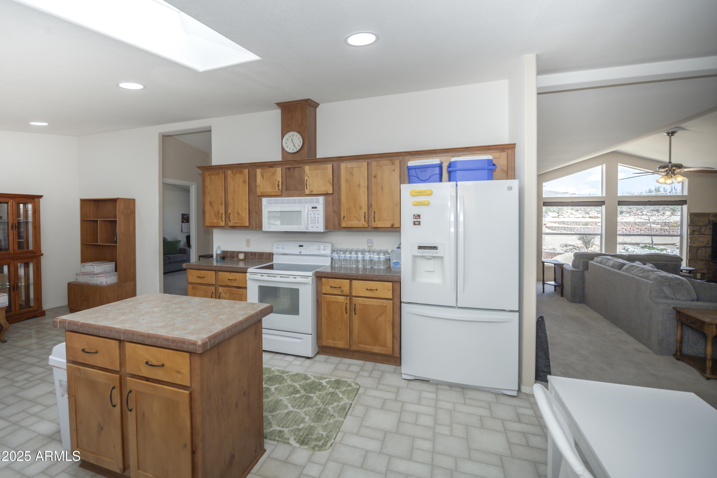 17985 Hunters Lane Dewey, AZ 86327 - Photo 13 of 45 a kitchen with stainless steel appliances granite countertop a refrigerator a stove and a sink