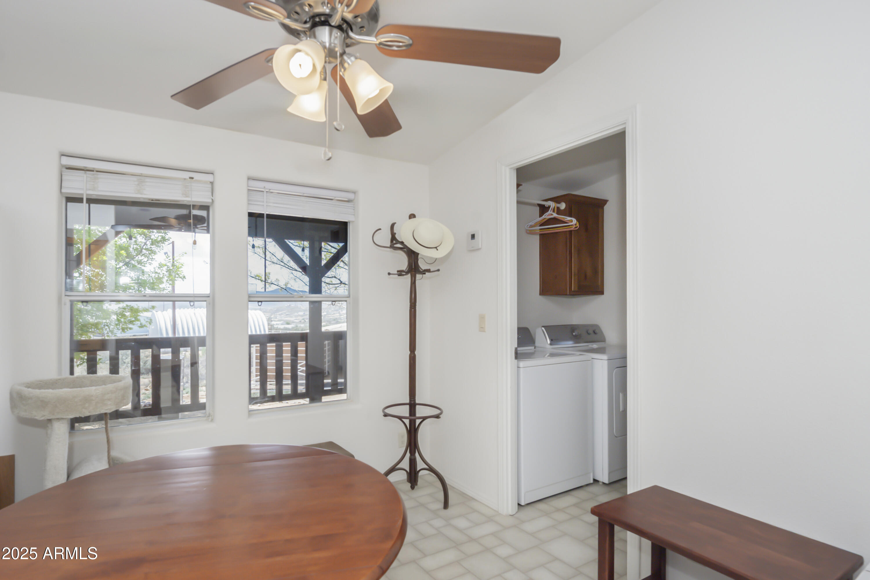 17985 Hunters Lane Dewey, AZ 86327 - Photo 14 of 45 a view of a livingroom with a furniture ceiling fan and wooden floor
