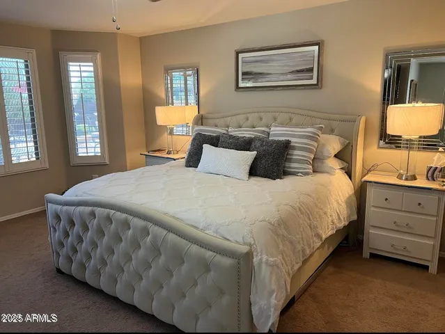 a bedroom with a bed and window