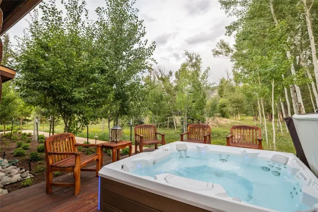 a view of backyard with sitting area