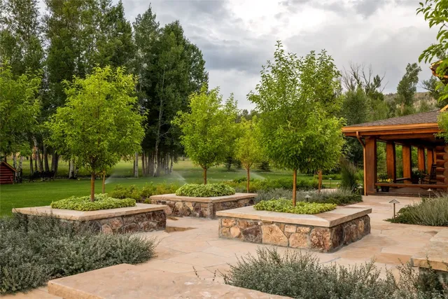 a garden view with a seating space