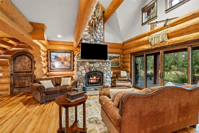 a living room with fireplace furniture and a flat screen tv