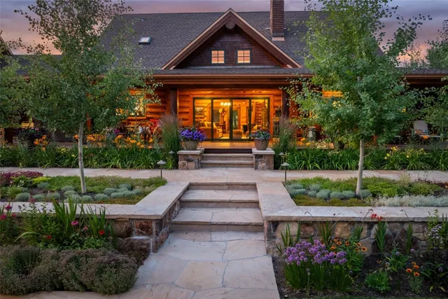 a front view of a house with garden