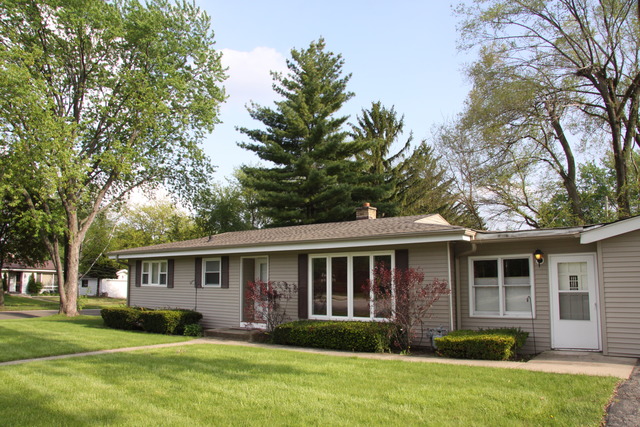 605 East Baldwin Road Palatine, IL 60074 - Photo 15 of 18 a front view of a house with garden and porch