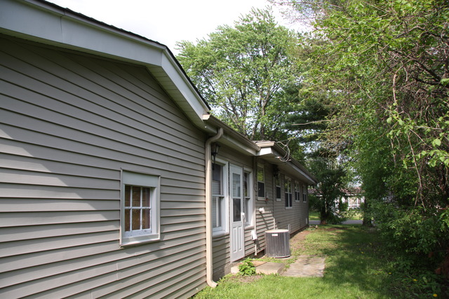 605 East Baldwin Road Palatine, IL 60074 - Photo 17 of 18 a backyard of a house with yard and outdoor seating