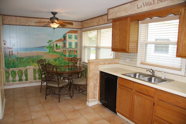 605 East Baldwin Road Palatine, IL 60074 - Photo 4 of 18 a kitchen with a sink and cabinets