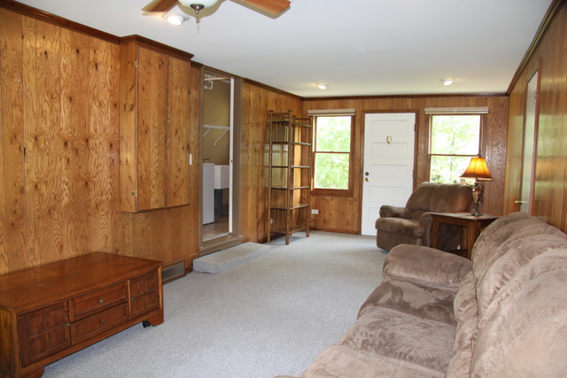 605 East Baldwin Road Palatine, IL 60074 - Photo 7 of 18 a living room with furniture and a window