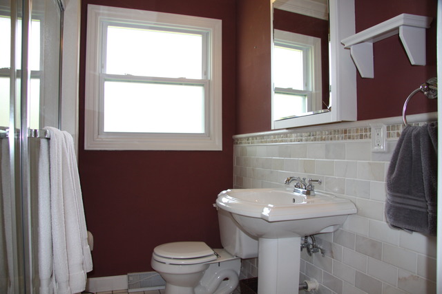 605 East Baldwin Road Palatine, IL 60074 - Photo 10 of 18 a bathroom with a sink a toilet and a mirror