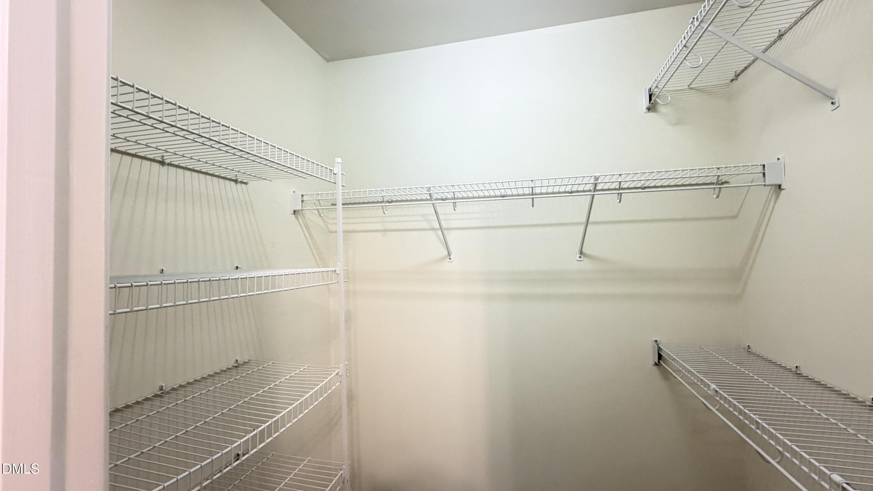 4123 Standing Rock Way Raleigh, NC 27604 - Photo 26 of 29 a view of a room with racks on the wall