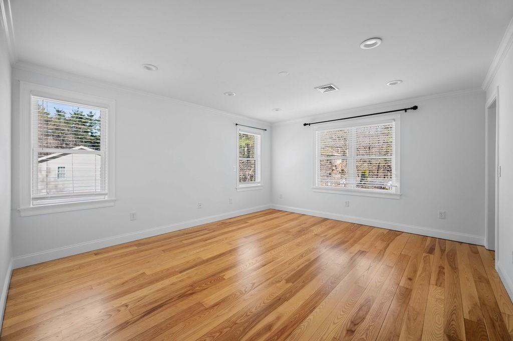 1 Learned Lane Salisbury, MA 01952 - Photo 15 of 41 a view of empty room with wooden floor and fan