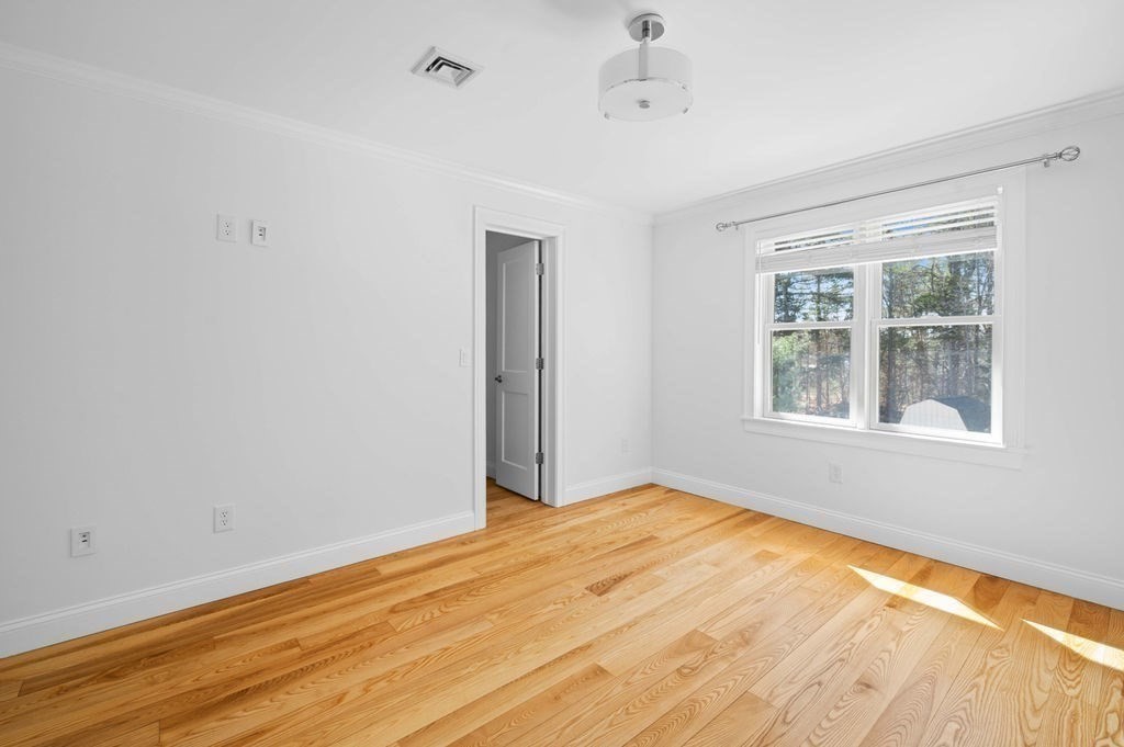 1 Learned Lane Salisbury, MA 01952 - Photo 20 of 41 a view of empty room with wooden floor and fan