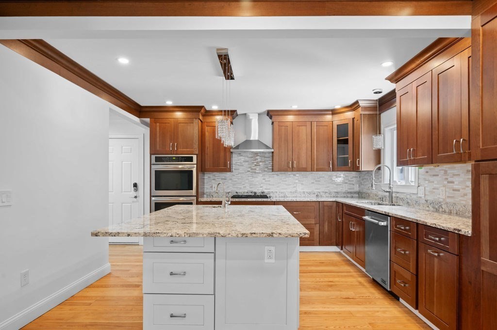 1 Learned Lane Salisbury, MA 01952 - Photo 5 of 41 a kitchen with granite countertop a sink stove cabinets and refrigerator