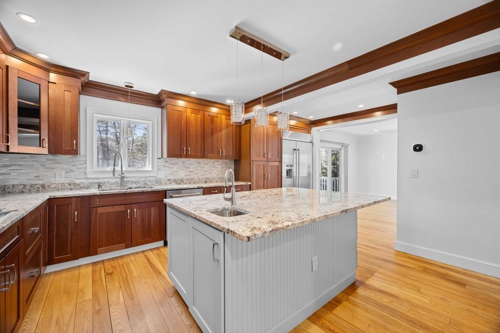 1 Learned Lane Salisbury, MA 01952 - Photo 6 of 41 a kitchen with stainless steel appliances granite countertop wooden cabinets a sink and dishwasher