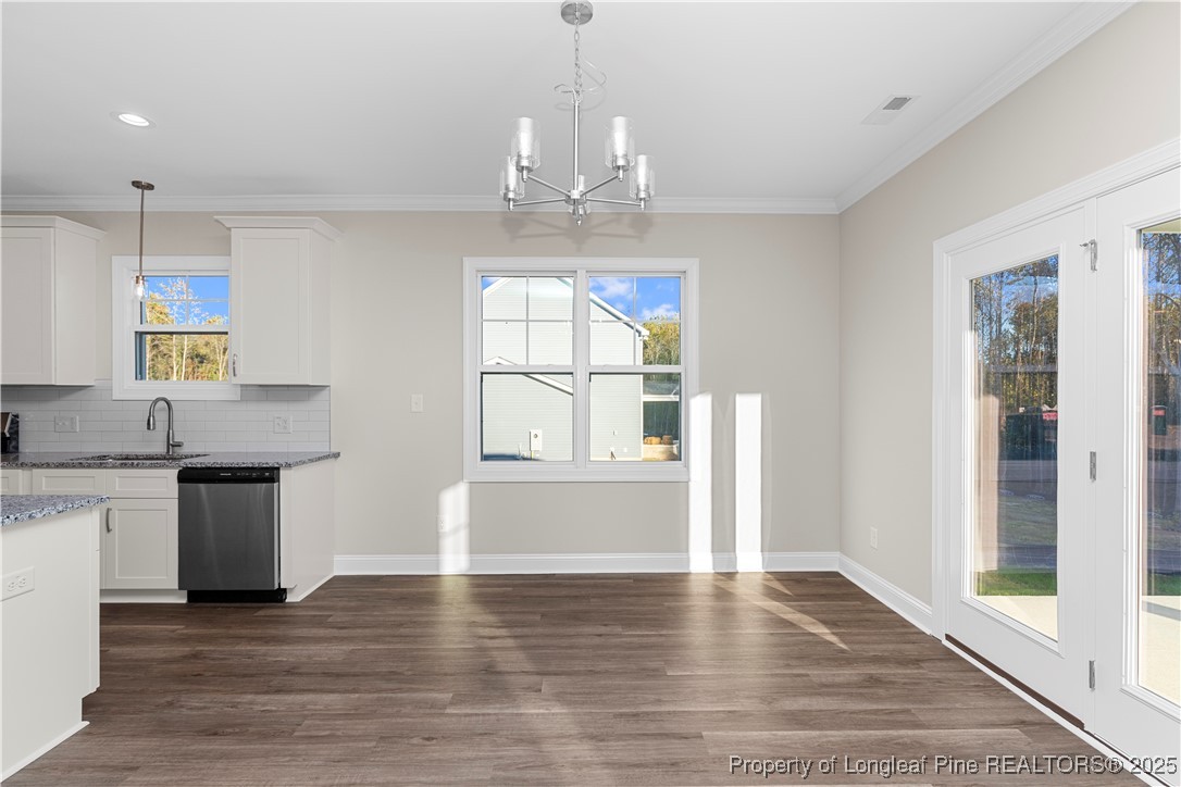 162 Surles Landing Way Benson, NC 27504 - Photo 11 of 28 a view of an empty room with window and wooden floor