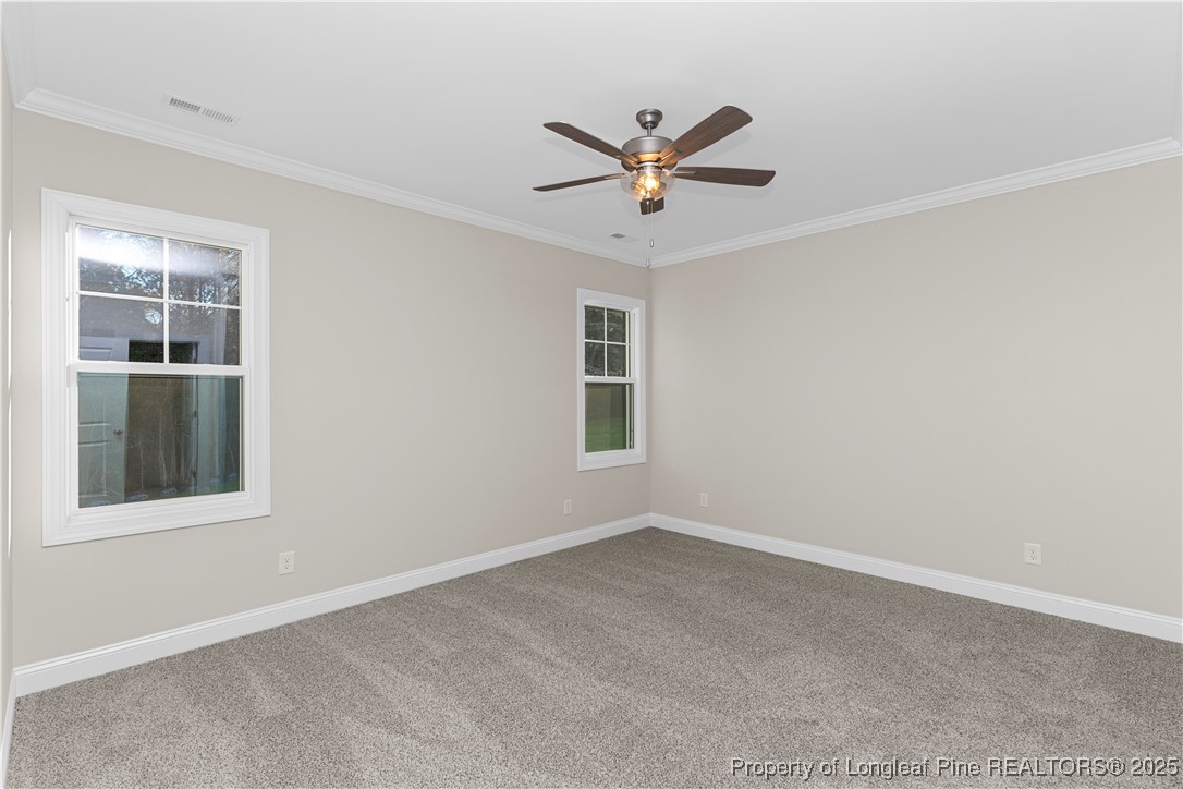 162 Surles Landing Way Benson, NC 27504 - Photo 15 of 28 a view of a big room with wooden floor and windows