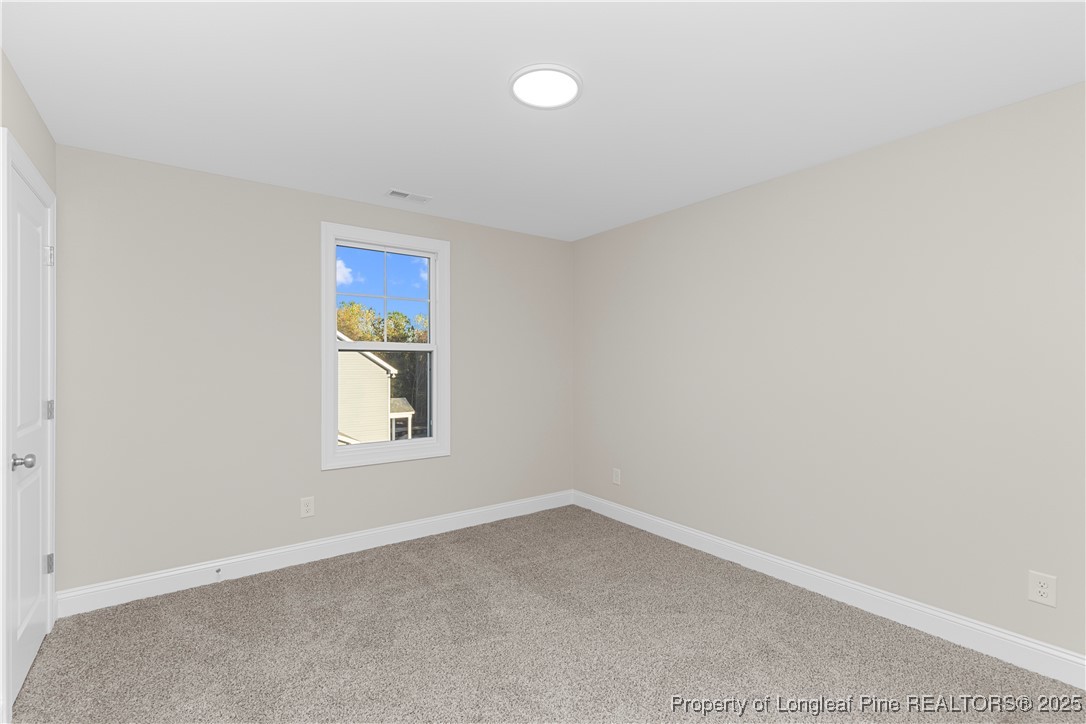 162 Surles Landing Way Benson, NC 27504 - Photo 20 of 28 an empty room with a window
