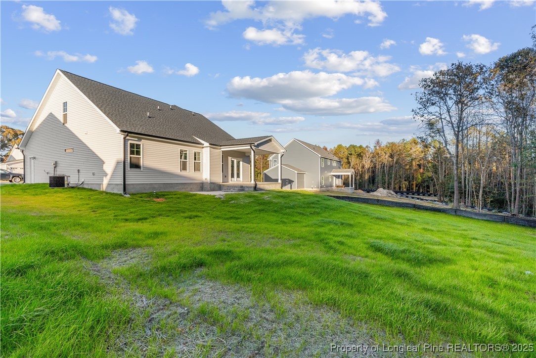 162 Surles Landing Way Benson, NC 27504 - Photo 27 of 28 a view of house with a big yard