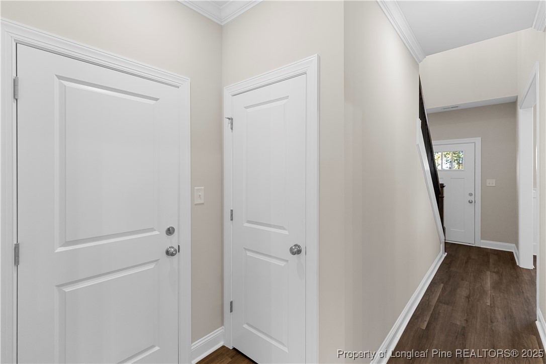 162 Surles Landing Way Benson, NC 27504 - Photo 3 of 28 a view of a hallway with wooden floor