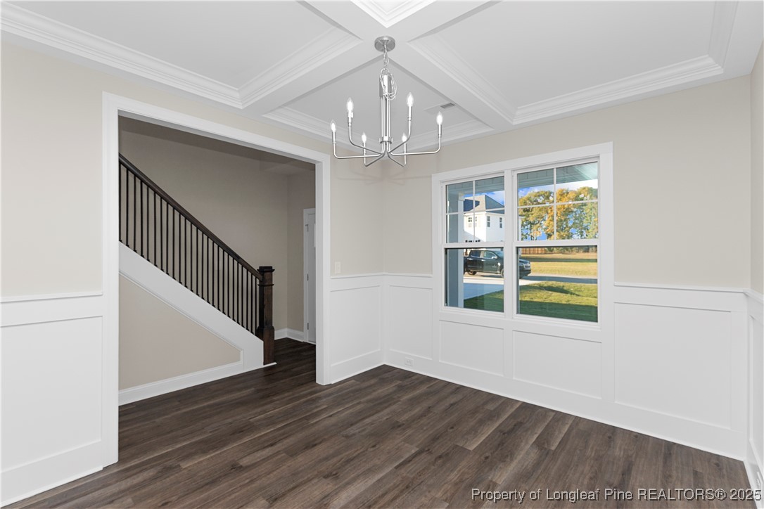 162 Surles Landing Way Benson, NC 27504 - Photo 4 of 28 a view of an empty room with wooden floor and a window