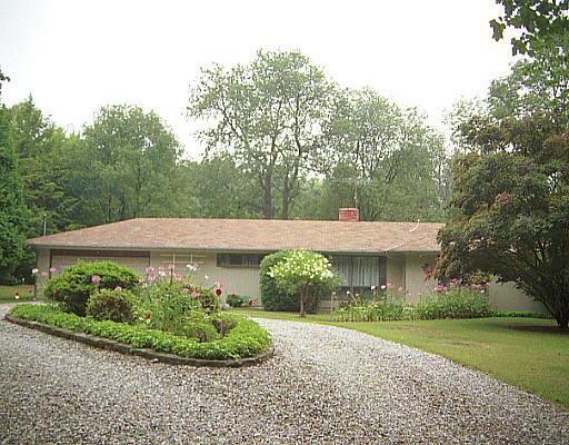 38 Fire Hill Road Redding, CT 06896 - Photo 1 of 1 a view of an house with backyard space and garden
