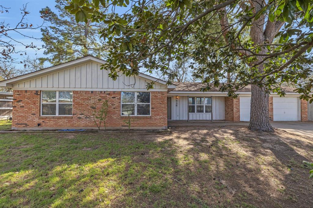 716 Cherry Lane Springtown, TX 76082 - Photo 1 of 1 a view of a yard in front of a house with large tree