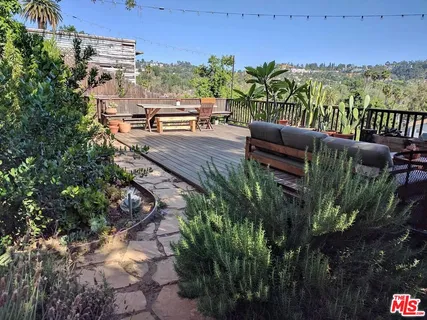 a view of a terrace with furniture