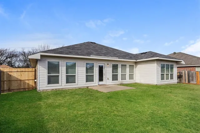 a view of a house with a garden
