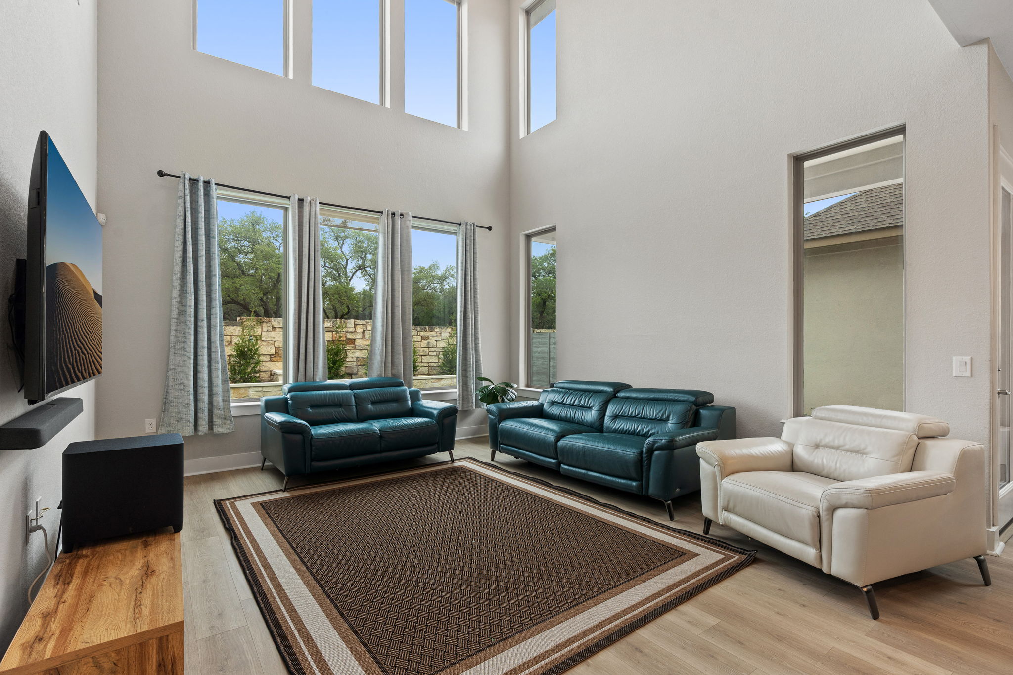 244 Diamondback Drive Georgetown, TX 78628 - Photo 15 of 37 Bright living area featuring high ceilings and large windows.