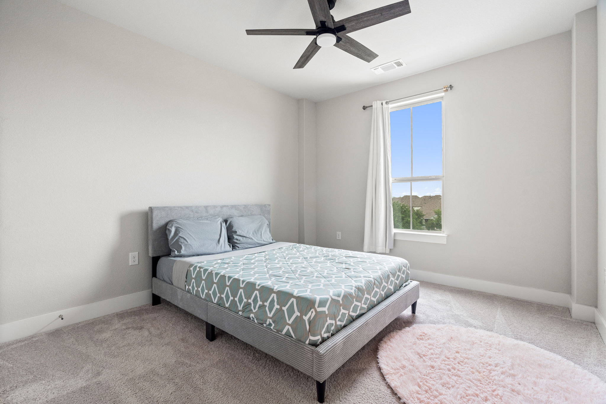 244 Diamondback Drive Georgetown, TX 78628 - Photo 30 of 37 Room featuring light gray carpet, white walls, and a single window with white trim.