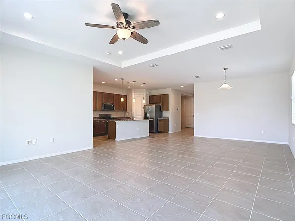 a view of a kitchen with a sink and a kitchen counter top