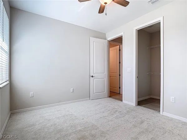 an empty room with fan